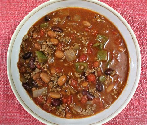 Stir in the beef broth, pinto beans, tomatoes, chipotles, tomato sauce, tomato paste and the vinegar. Chili with Beans - Mindy's Cooking Obsession