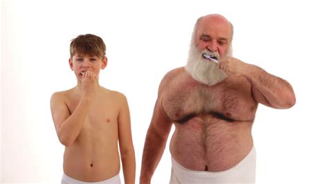 Grandpa And His Grandson Brushing Their Teeth Stock Footage Video
