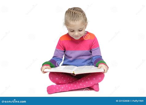 Little Girl Sitting On The Floor Reading The Book Royalty Free Stock