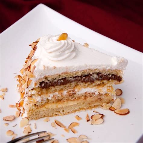 Montilio's italian rum cake starts with sponge cake that's soaked in secret rum syrup, then filled with layers of italian chocolate and vanilla custard, and frosted with real whipped cream. Italian Wedding Cake aka Cream Cake aka Rum Cake-looks ...