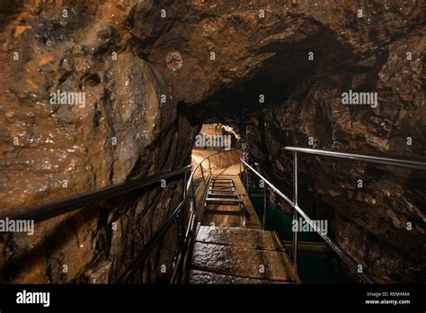 Touristic Cave Underground With Railing Wooden Bridges And Light