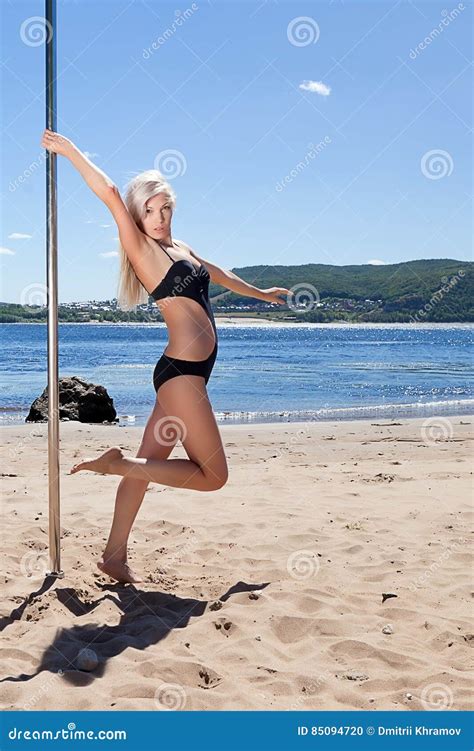 Blonde Dancer In Black Bathing Suit With Pole Stock Photo Image Of