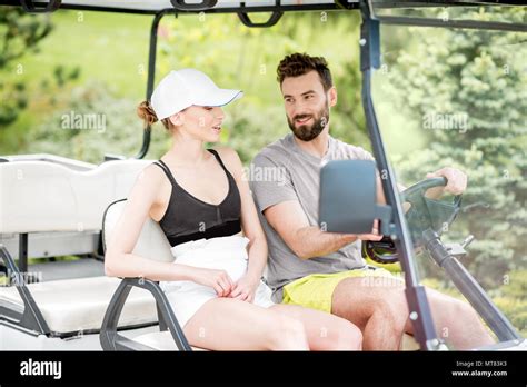 Couple In The Golf Cart Stock Photo Alamy