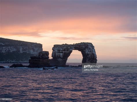 Darwin's arch is a natural rock arch feature situated to the southeast of darwin island in the pacific ocean. Darwins Arch Sunset High-Res Stock Photo - Getty Images