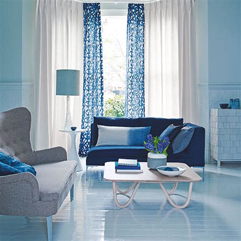 Blue Living Room With Patterned Curtains Decorating
