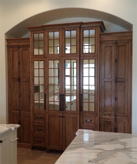 This tall white pantry cabinet with shelves is simply perfect for traditional kitchens. Tall Cabinets - Cabinet Joint