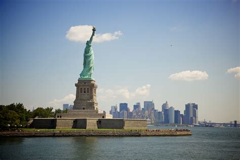 Standing 305 feet high, it represents a woman holding a torch in her raised right hand and a tablet bearing the adoption date of the declaration of independence in. File:Statue of Liberty, New York, USA-30July2010 (1).jpg ...