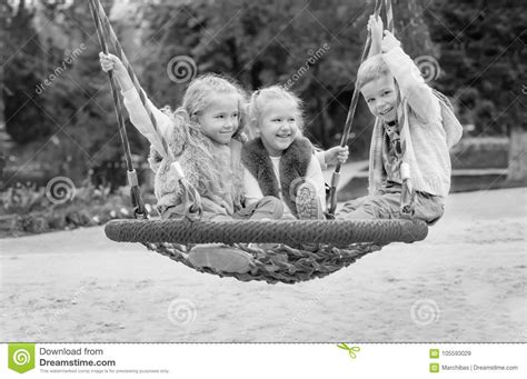 Three Children Playing In The Park Stock Image Image Of Playful