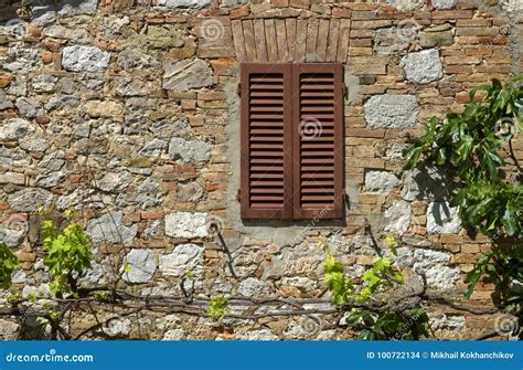 Stone Wall And Window With Closed Shutters Stock Photo Image Of