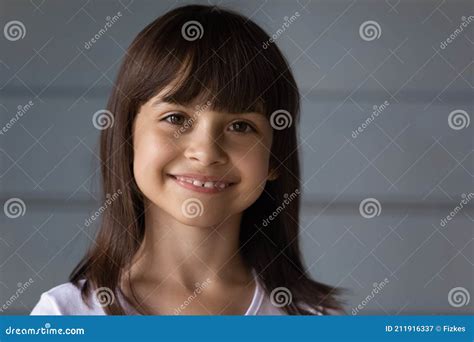 Headshot Portrait Of Happy Hispanic Girl Look At Camera Stock Image