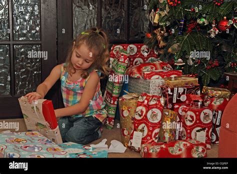 3 Year Old Girl Opening Christmas Presents Stock Photo Alamy