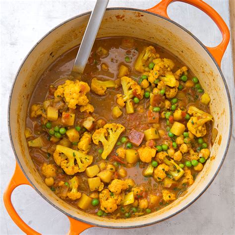 Indian Style Curry With Potatoes Cauliflower Peas And Chickpeas