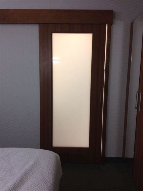Etched or frosted glass doors connect different living spaces by allowing natural light to pass through without sacrificing the privacy of a traditional door. Sliding frosted glass bathroom door | Glass bathroom door ...