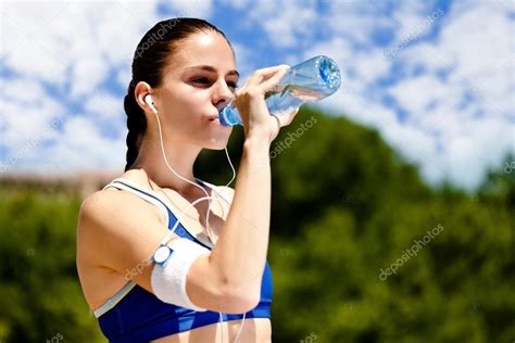 Woman Drinking Water — Stock Photo © Luckybusiness 13368675