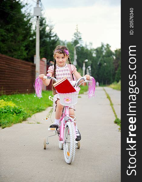Young School Girl Rides Her Pink Bicycle Free Stock Images And Photos