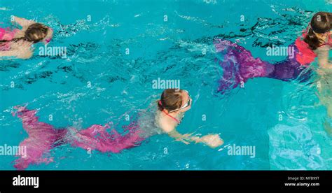 Mermaids In A Swimming Pool Stock Photo Alamy