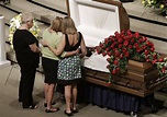 Mourners view the open casket containing the remains of Jennings ...