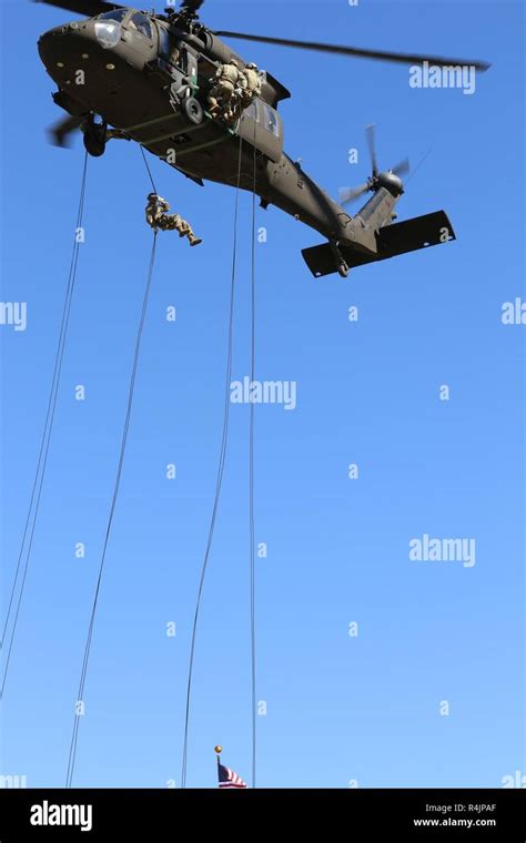 Soldiers Rappel From A Uh 60 Black Hawk Helicopter During The Air