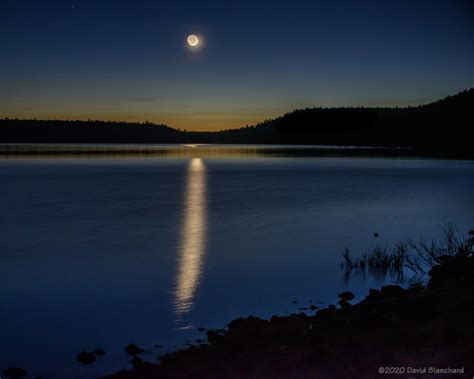 A Thin Crescent Moon Reflected In The Lake Flagstaff Altitudes