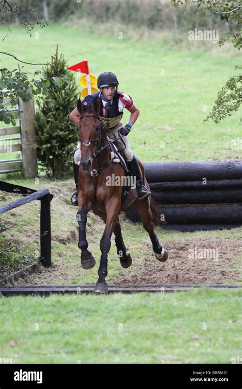 Horse And Rider Jumping A Ditch During The Cross Country Phase Of A One