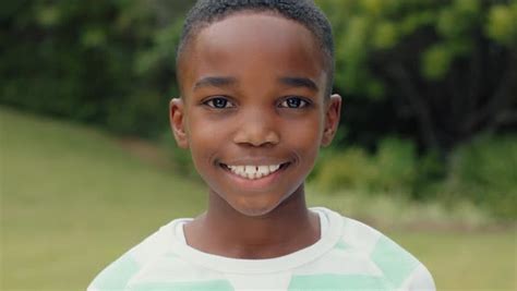 Portrait Cute African American Boy Smiling With Playful Excitement