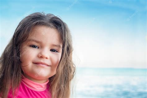 Premium Photo Portrait Of A Child At Sea Girl On A Background Of