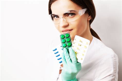 premium photo sexual health a doctor in a white coat holding a pill for a healthy sex life of