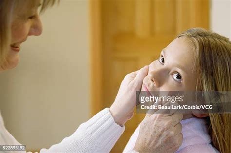 Grandma Pinching Cheek Photos And Premium High Res Pictures Getty Images