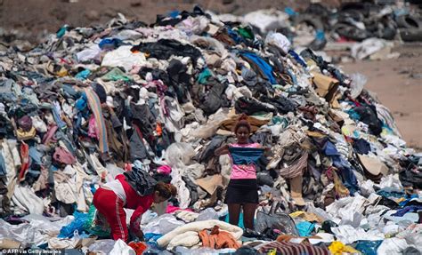 The Fast Fashion Waste Mountain Gigantic Pile Of Clothes Looms Over