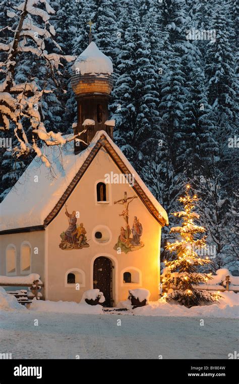 Christmas Chapel With Illuminated Tree In Upper Bavaria Germany Stock