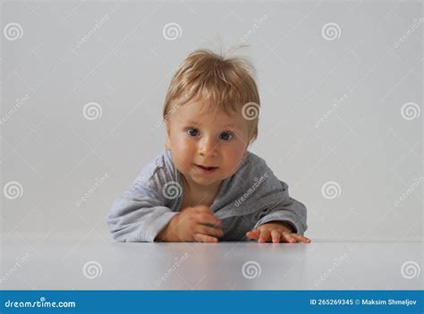 Little Happy And Smiling Cute Baby In The Studio Portrait Of A One