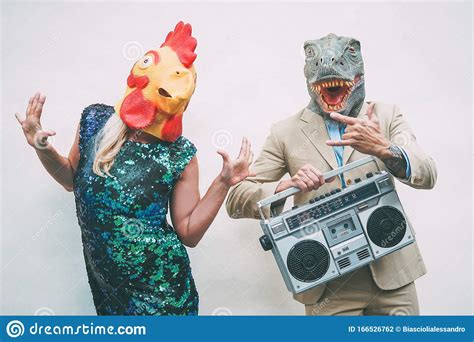 Crazy Senior Couple Wearing Chicken And T Rex Mask While