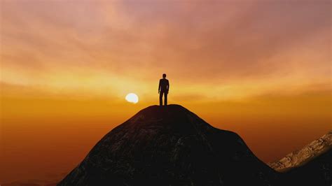 Man On The Top Of A Mountain Watching The Sunset Free Stock Video