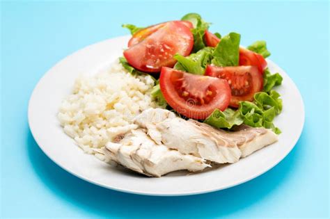 Boiled Fresh Fish With Boiled Rice And Fresh Salad Stock Photo Image