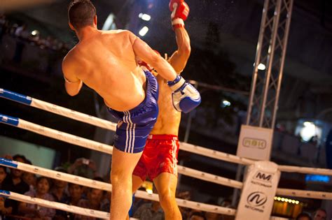 muy thai heavyweights a solid left hook catches the french muay thai fighter square on the