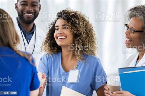 Medical Intern Enjoys Meeting New Coworkers Stock Photo Download