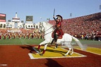 Traveler, mascot of the USC Trojans runs on the field before the game ...