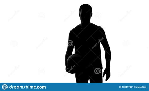 Male Athlete Silhouette Holding Ball And Looking Into Camera Sport And