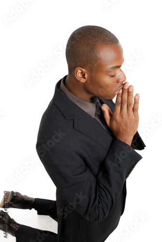 Business Man Praying On His Knees Buy This Stock Photo And Explore