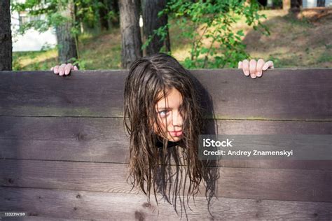 The Head Of A Girl With Long Disheveled Hair Clamped In A Guillotine A Scene Of A Medieval