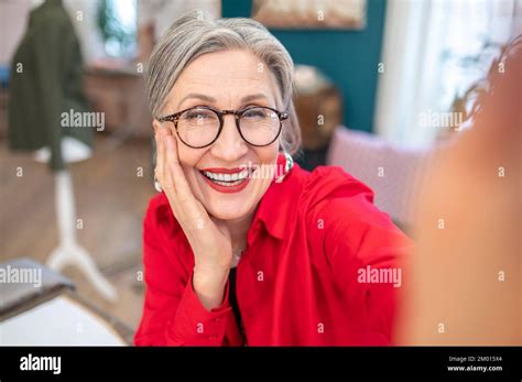 Good Moments Happy Stylish Gray Haired Woman In Glasses Touching Face