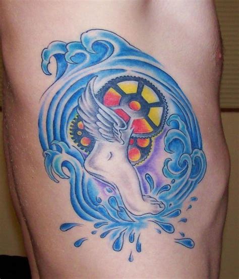 Side Tattoo Foot Winged With Wheel On The Water Tattooimages Biz