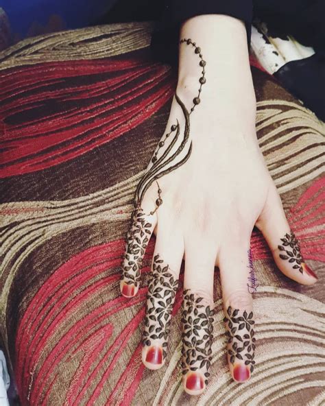 Image May Contain One Or More People And Closeup Finger Henna