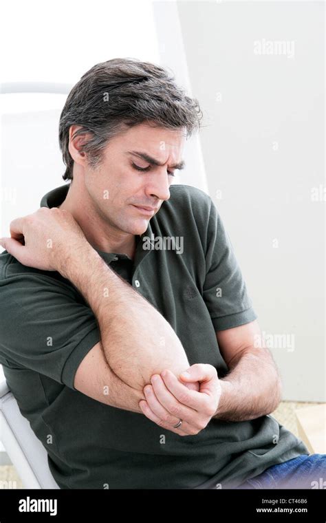 Man With Painful Elbow Stock Photo Alamy