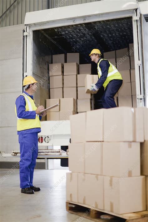Workers Unloading Boxes From Truck Stock Image F0043531 Science Photo Library