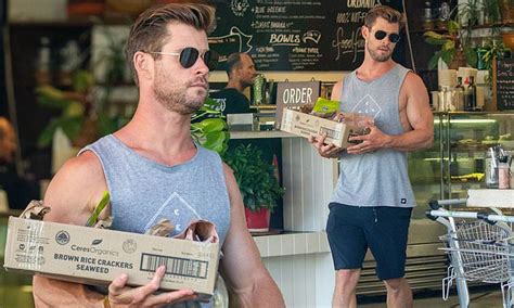 Chris Hemsworth Shows Off His Bulging Biceps As He Stocks Up On Some
