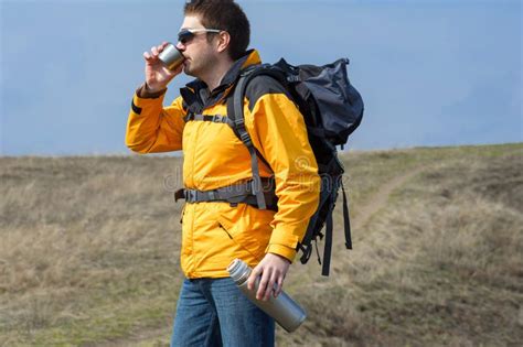 Man Holding Thermos Hot Tea Outdoors Hiking Leisure01 Stock Photos