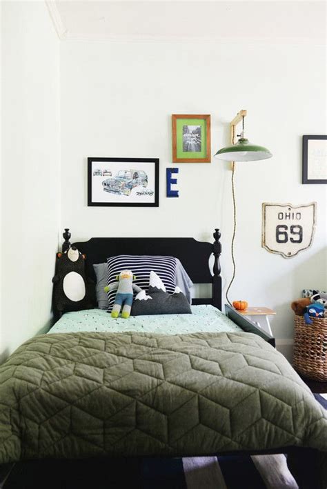 Sound off in the comment section below! Boys bedroom idea. Prints and wall light above the bed ...