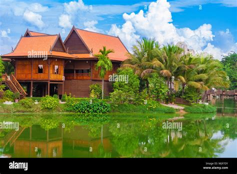 A Typical Khmer Keng House On Pilings With Its Lovely Roofs Stands