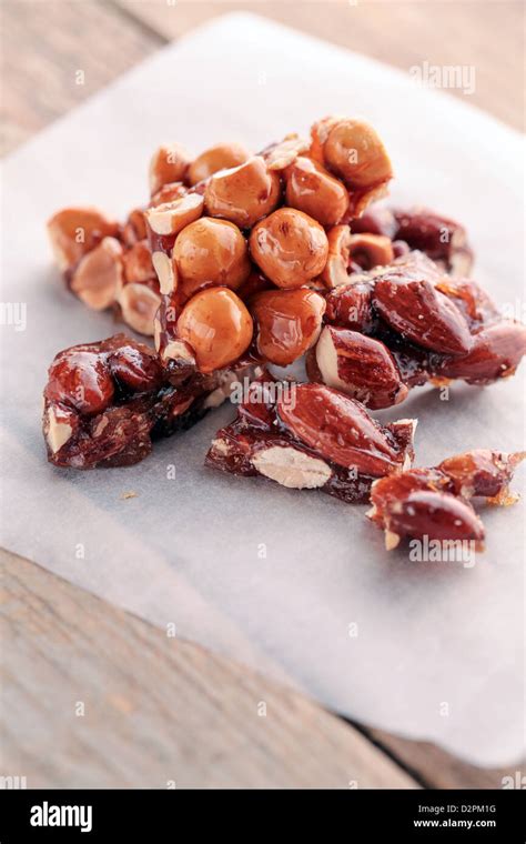 Hazelnut And Almond Brittle On Paper Stock Photo Alamy